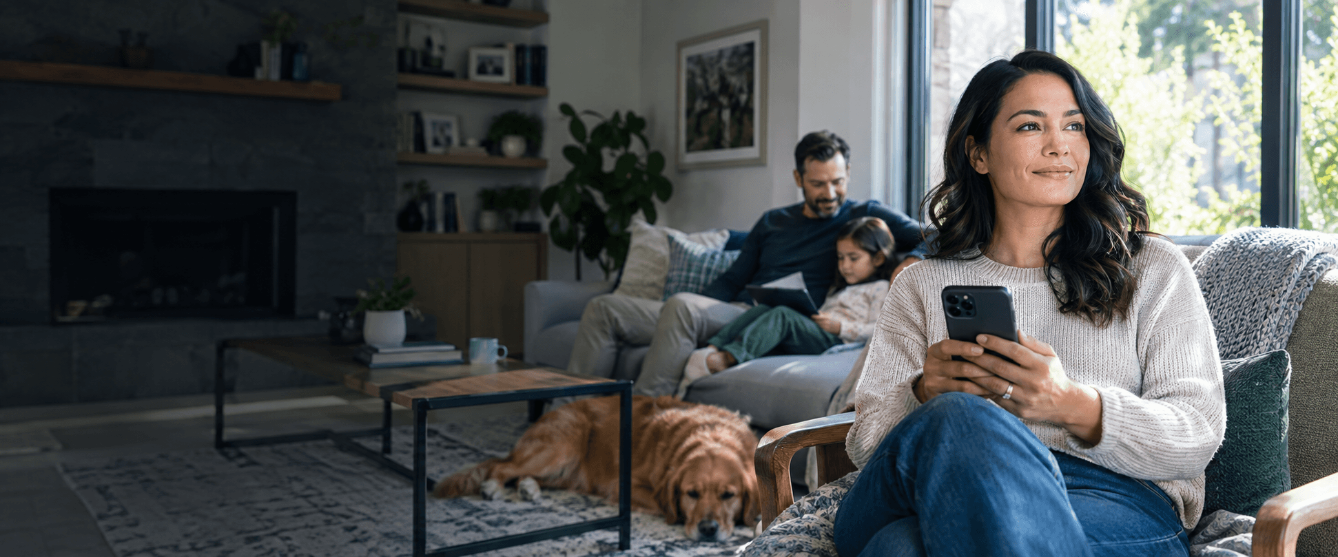 A woman and her family confidently managing their digital safety